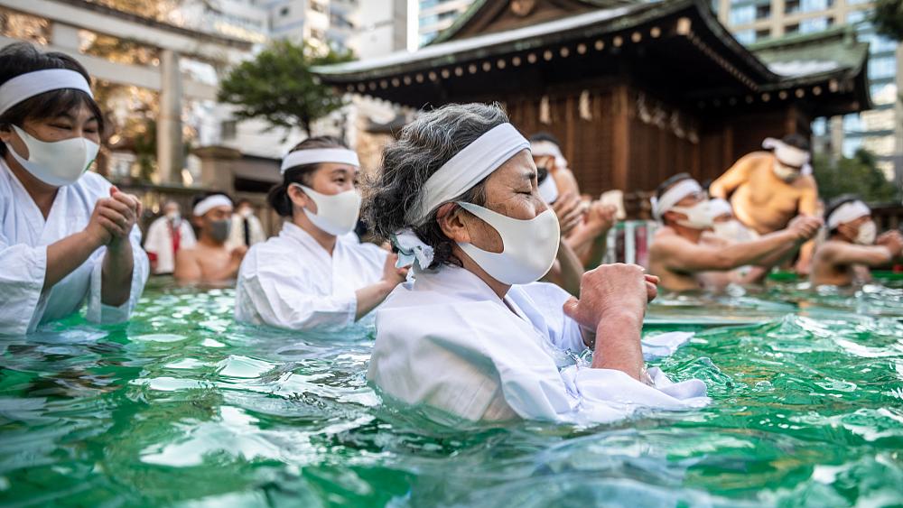 Tokyo worshippers pray for good health in ice water purification ceremony