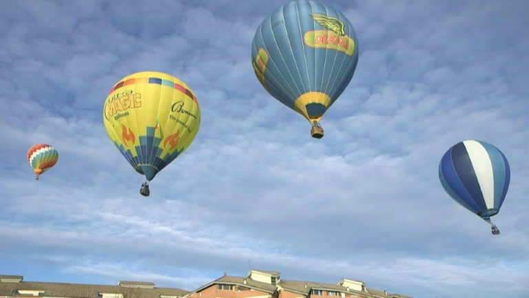 Hot air balloons colour the Mondovi sky in Italy