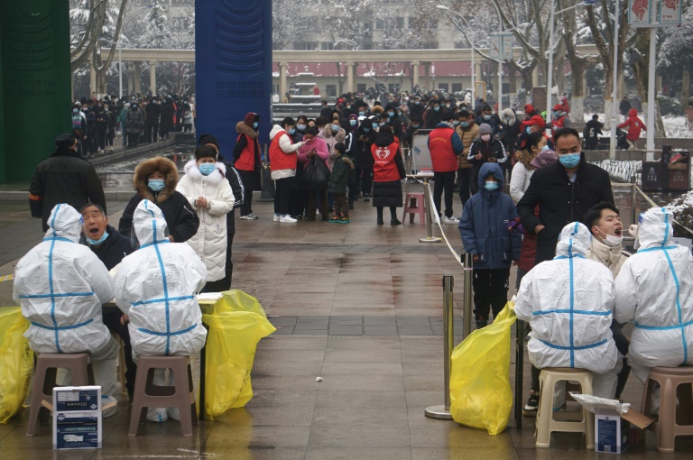 Hong Kong bans flights as Omicron surges around globe