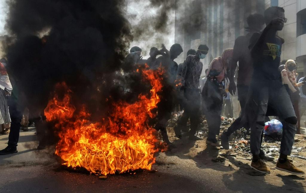 Tear gas and burning tyres as thousands rally in Sudan against coup