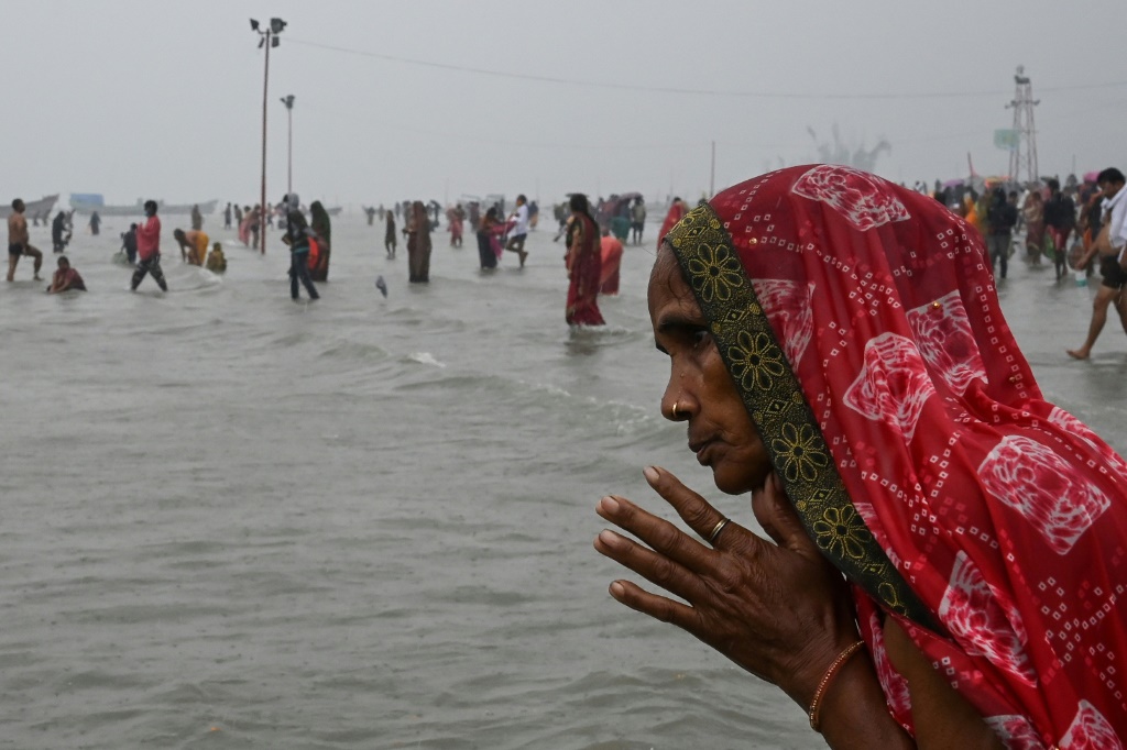 Drones spray holy water at India Hindu festival as huge crowds defy Covid rules