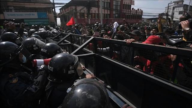 Nepal police fire tear gas as MPs debate US grant