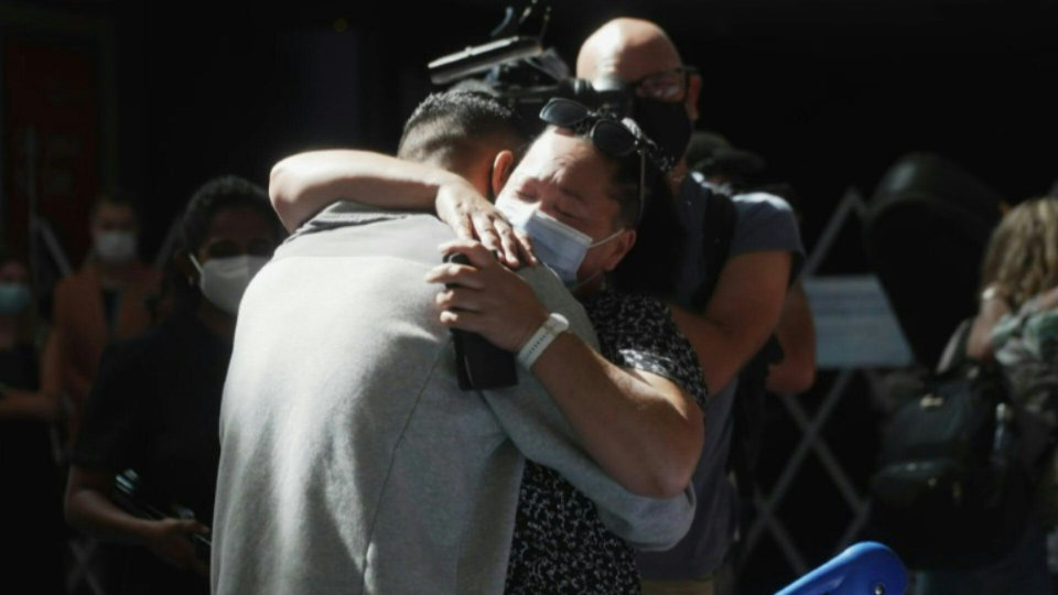 Hugs and tears at Auckland airport as New Zealand relaxes border