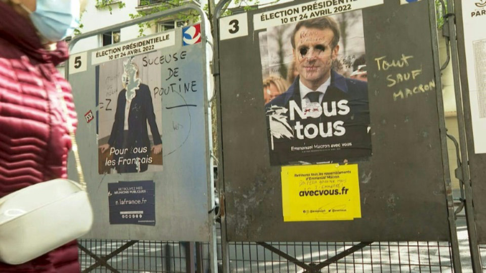 Le Pen and Macron French election posters vandalised in Paris