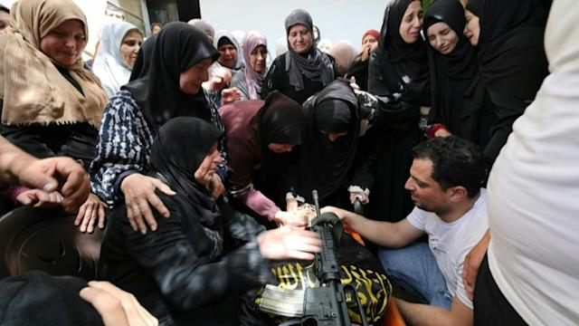 Mourners attend funeral of Palestinian teenager shot by Israeli forces