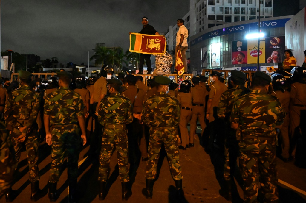 Crisis-hit Sri Lanka hikes rates as protests spiral