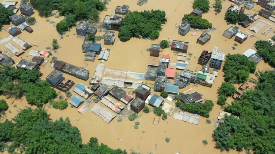 Muddy flood inundates buildings in southern China