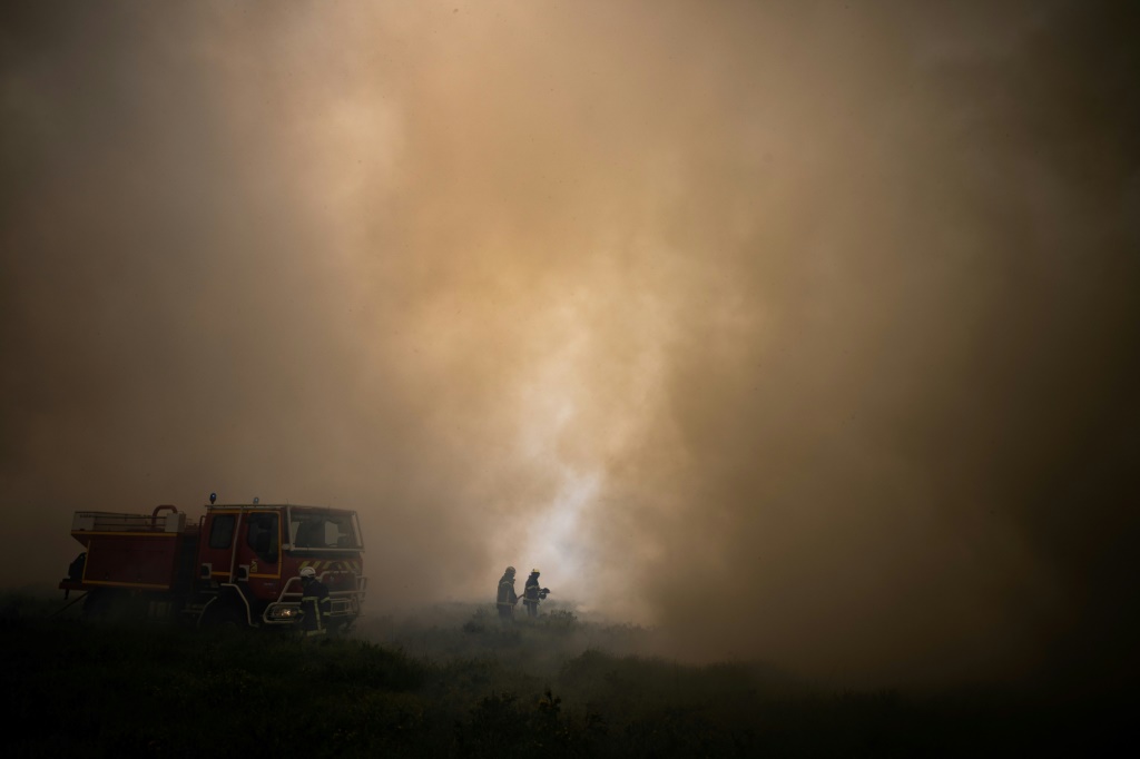 French fires coming under control as heat drops