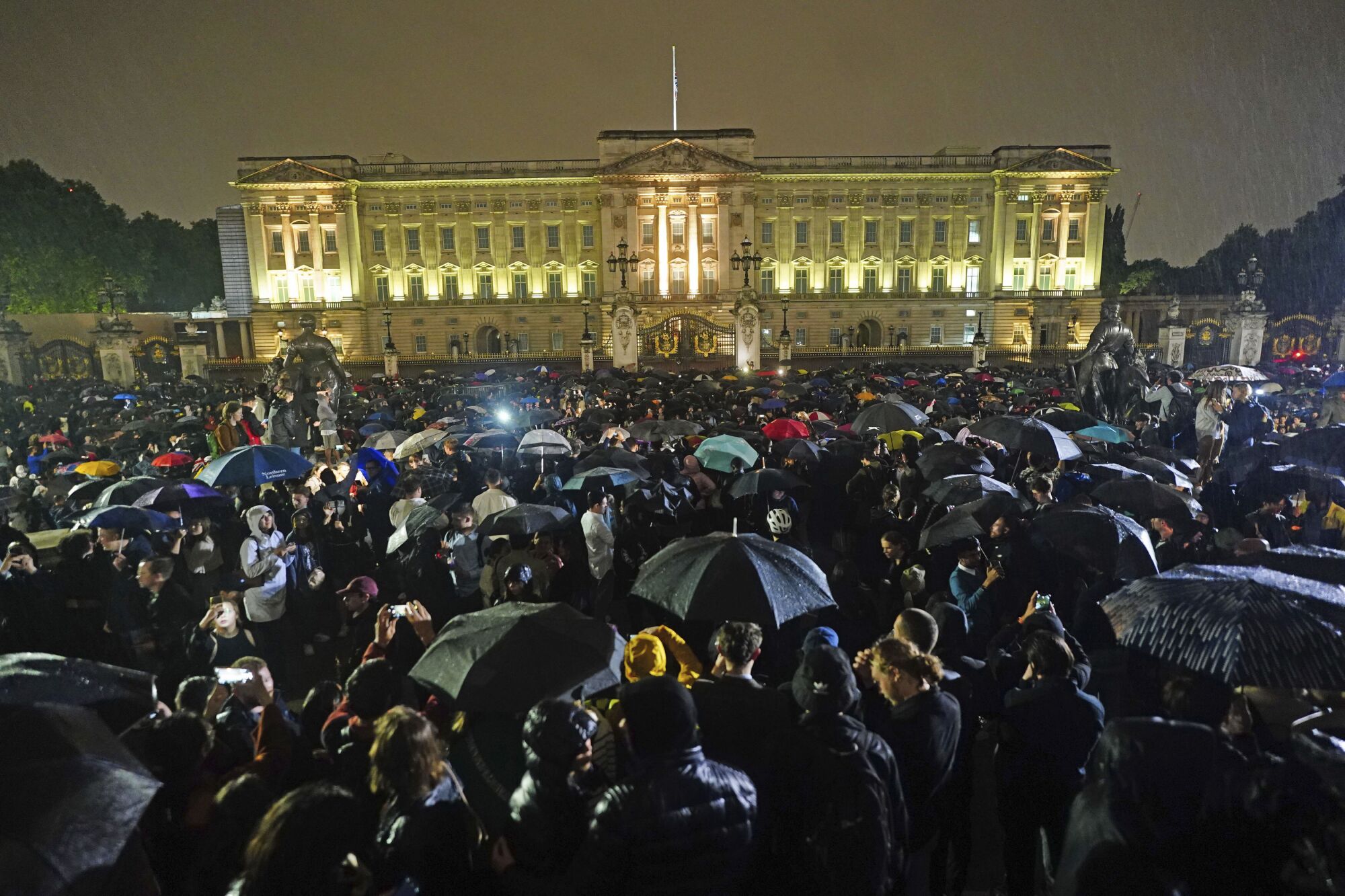 People gather outside Buckingham Palace after death of Queen Elizabeth II