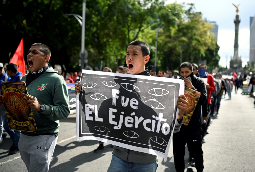 Thousands march to demand justice for Mexico’s missing students