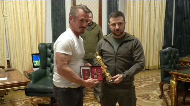 American actor Sean Penn hands over his Oscar statuette to Zelensky