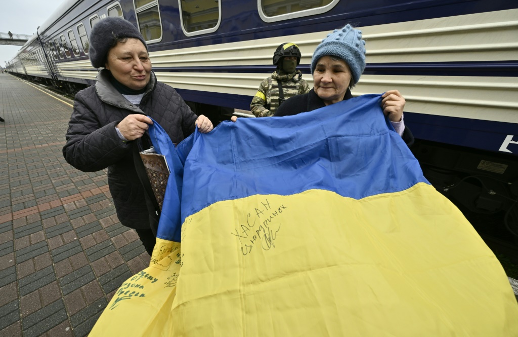 ‘We’re free’: Ukraine families reunite as Kherson train station reopens