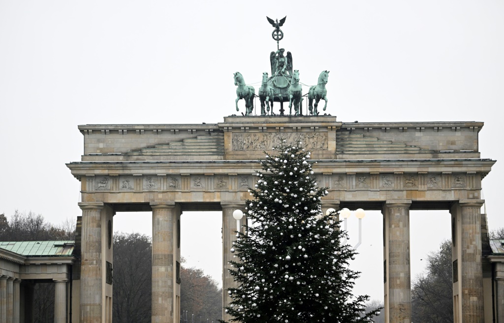 German climate activists cut top off Christmas tree