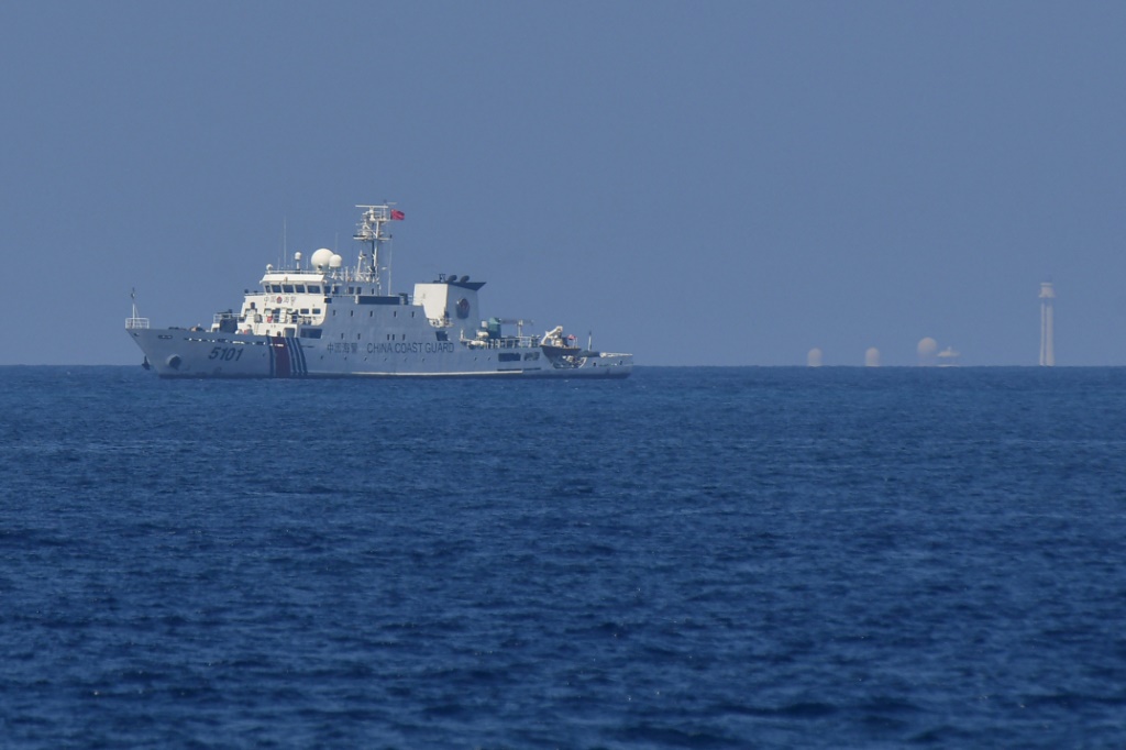 China says Philippine boat’s ‘provocative action’ caused near-crash