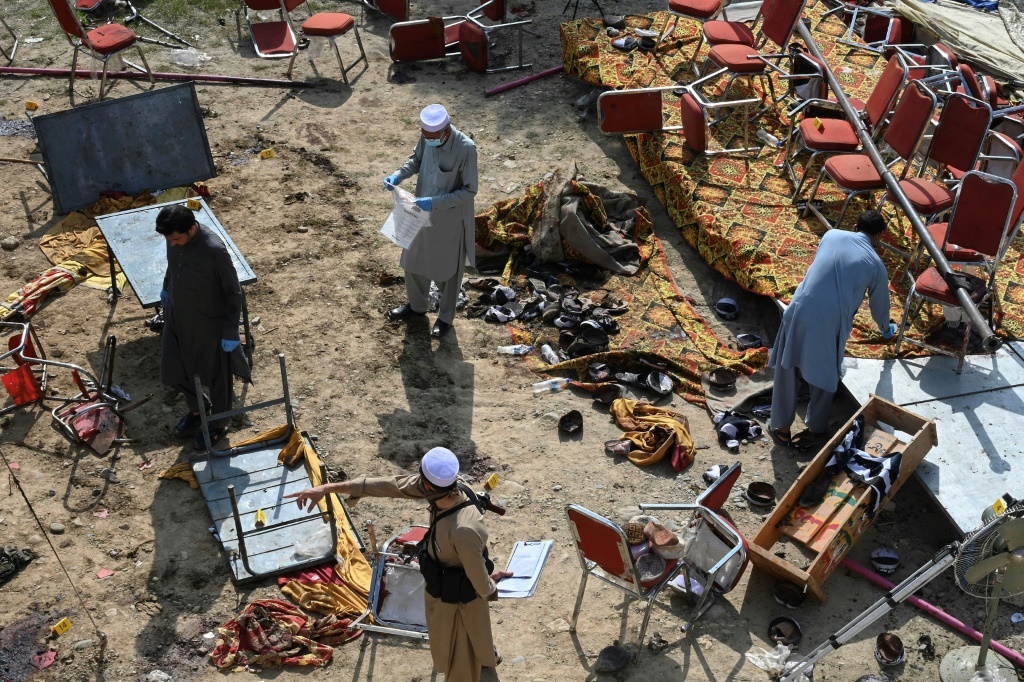 Empty seats, discarded shoes remain after Pakistan bomb kills 47