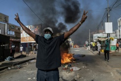 Police and protesters clash after Senegal election postponed