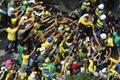 Brazil’s Bolsonaro slams election ban as thousands rally behind him