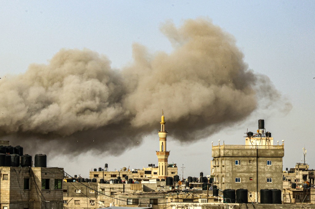 Israel bombs Gaza, fights Hamas around hospitals