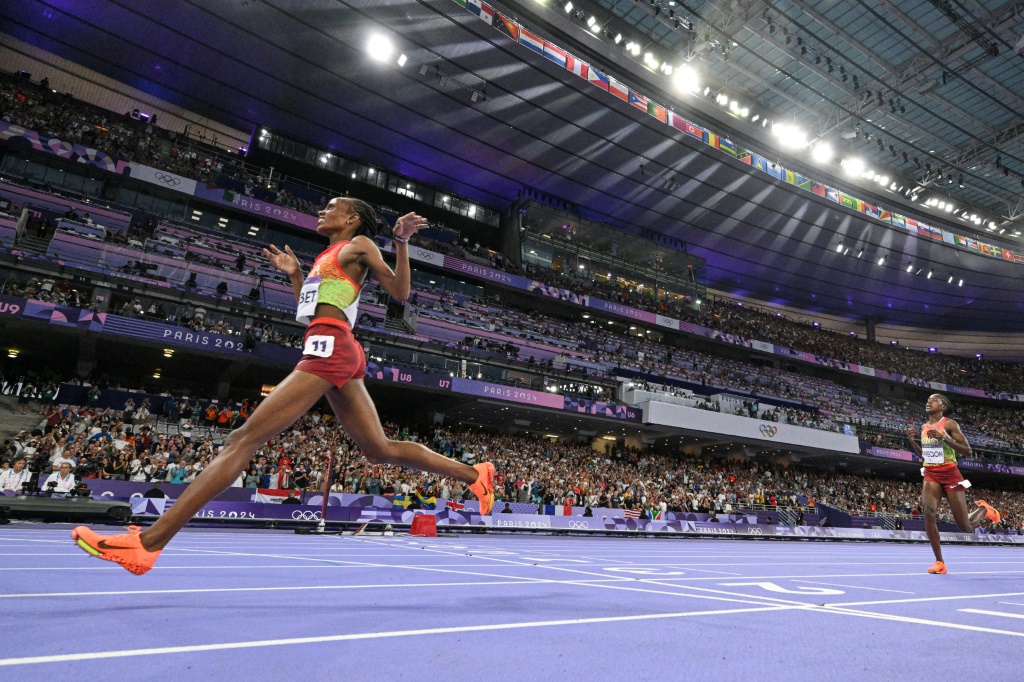 Kenya’s ‘smiling assassin’ Chebet wins Olympic 5,000m gold